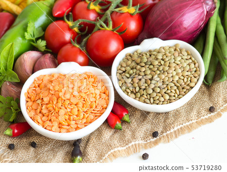 Red and green lentils and vegetables 53719280