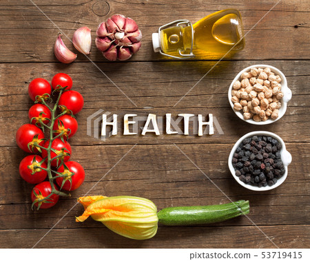 Vegetables and chickpea on a wooden table 53719415