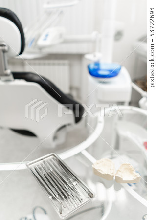 Stomatological tools in the dentists clinic. Dental work in clinic. Operation, tooth replacement 53722693