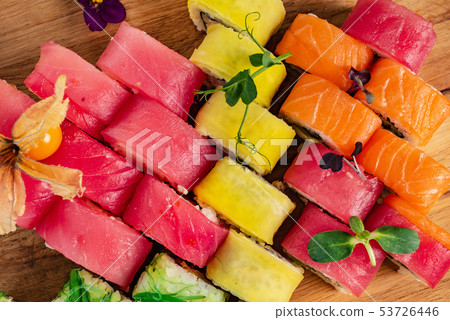 Rainbow Sushi Roll with salmon, eel, tuna, avocado, royal prawn, cream cheese Philadelphia, caviar tobica, chuka. Sushi menu. Japanese food 53726446