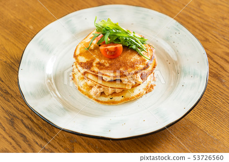 potato pancakes with chicken and salad 53726560
