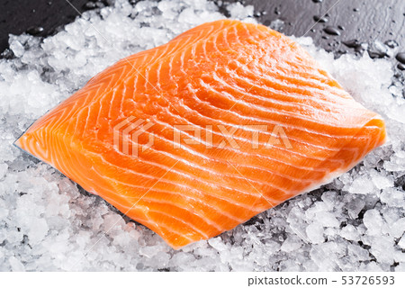 Raw salmon filet on the ice 53726593