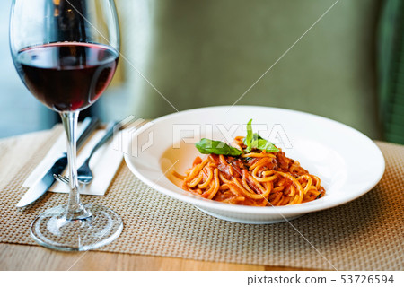 pasta and wine in the restaurant pasta and wine in the restaurant 53726594