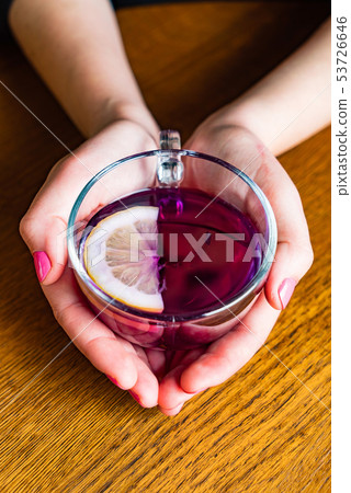 woman drinking Blue Butterfly Pea Tea woman drinking Blue Butterfly Pea Tea 53726646