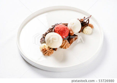 brownie with ice cream on the white plate brownie with ice cream on the white plate 53726980