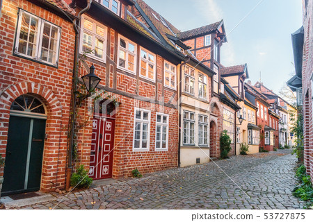 Street with Medieval old brick buildings. Street with Medieval old brick buildings. 53727875