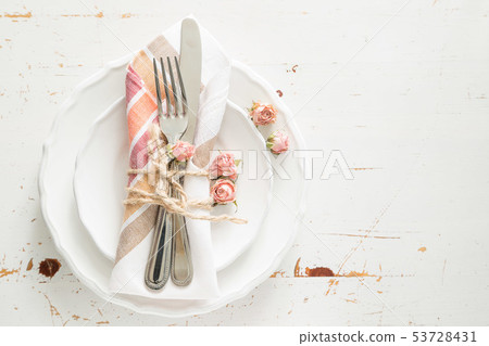 Romantic table setting with died flowers 53728431