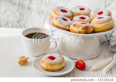 Symbols of Hanukkah celebration on wood background Symbols of Hanukkah celebration on wood background 53728528