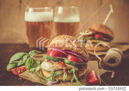 Chicken grill burger on wood background Chicken grill burger on wood background 53728932