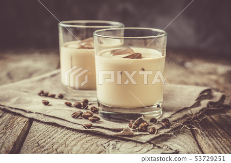 Coffee liqueur in glasses with ice and beans Coffee liqueur in glasses with ice and beans 53729251