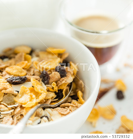 Breakfast - muesli and fruits on white background 53729332