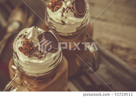 Cold coffee drink in glass jar Cold coffee drink in glass jar 53729511