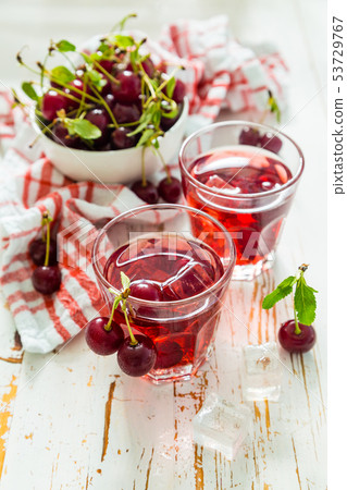 Cold cherry summer drink in glasses Cold cherry summer drink in glasses 53729767