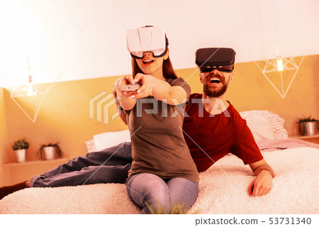 Nice couple playing different virtul games while being at home 53731340