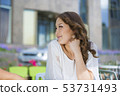 young beautiful asian woman looking up 53731493