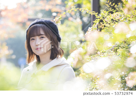 A woman in a coat 53732974