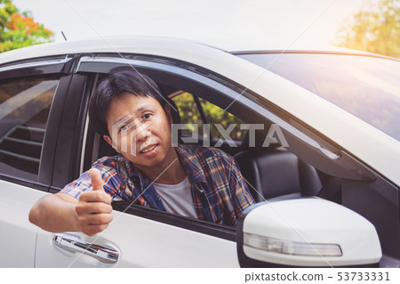 Asia man smile happy and drive car Asia man smile happy and drive car 53733331
