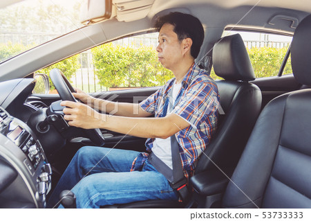 Asia man smile happy and drive car Asia man smile happy and drive car 53733333
