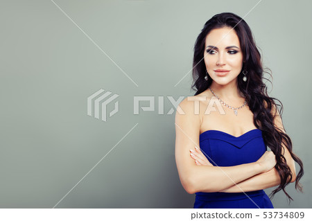 Cheerful woman with diamond necklace and earrings Cheerful woman with diamond necklace and earrings 53734809
