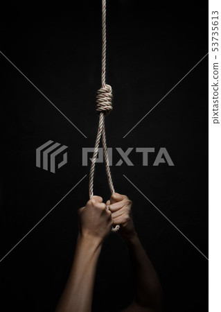 Hands holding rope slipknot in concept suicide Hands holding rope slipknot in concept suicide 53735613