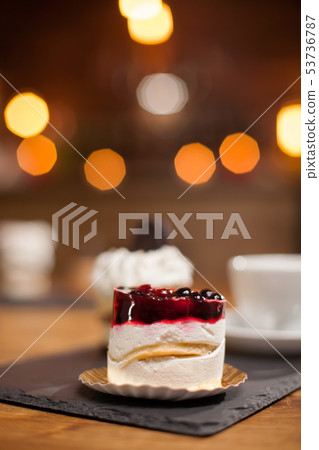 Tasty and delicious cake with fruits on top 53736787
