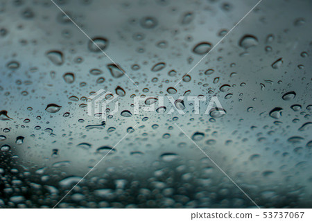blur backgruond,Rain water on the car glass. blur backgruond,Rain water on the car glass. 53737067
