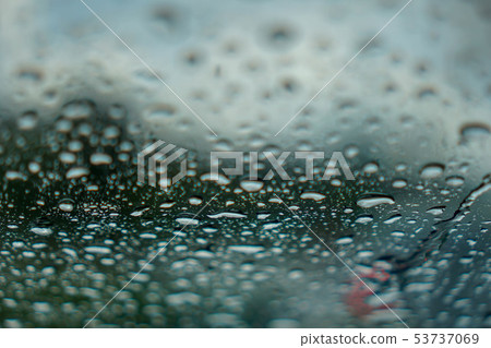 blur backgruond,Rain water on the car glass. blur backgruond,Rain water on the car glass. 53737069