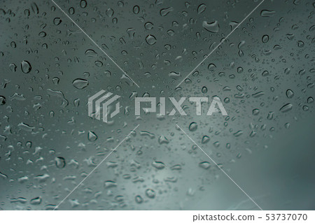 blur backgruond,Rain water on the car glass. blur backgruond,Rain water on the car glass. 53737070