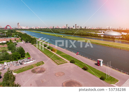 Rowing canal illuminated by bright sunshine. Panoramic view. Shooting from above, aerial filming 53738286