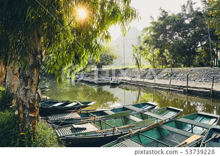 Waterfront with rowboats 53739228