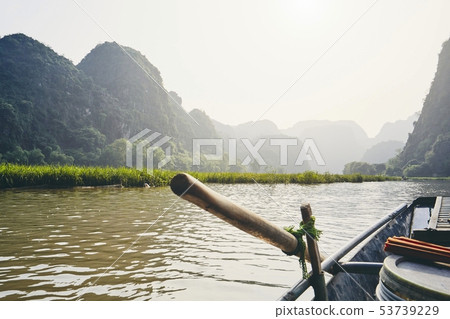 Rowboat against karst formation Rowboat against karst formation 53739229