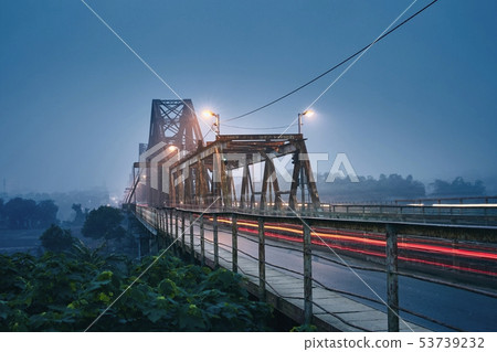 Bridge in mysterious fog 53739232