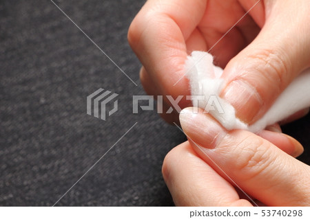 Remove the nail polish with a light removal solution. 53740298