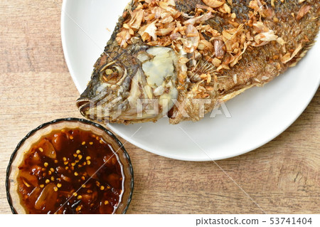 batter fried mango fish topping chop garlic  53741404