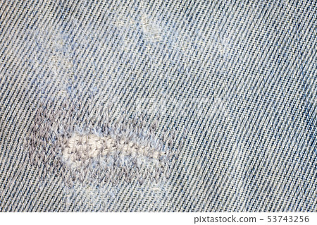 Jeans torn denim texture background. Jeans torn denim texture background. 53743256