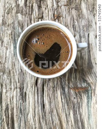 a cup of Turkish coffee on wooden table a cup of Turkish coffee on wooden table 53745040