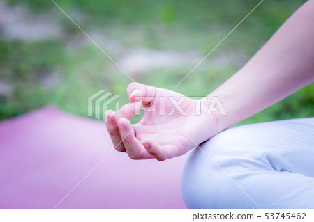 yoga Lotus pose on yoga mat 53745462