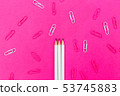 White pencil on a pink background 53745883