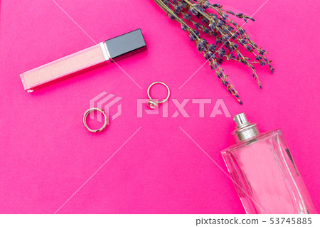 Female accessories on plastic pink background. 53745885