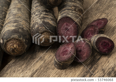 chopped red carrot on a wooden table 53746068