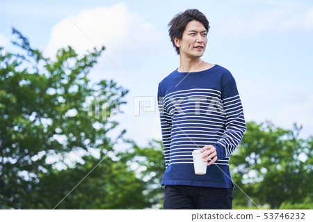 Young man blue sky 53746232