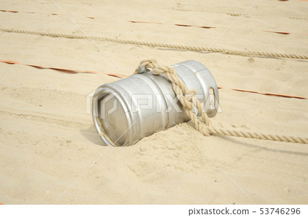 Sports competition with a barrel and a rope  53746296