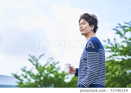 Young man blue sky 53746324