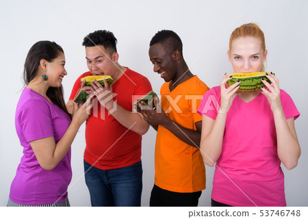 Studio shot of happy teenage girl with diverse group of multi et Studio shot of happy teenage girl with diverse group of multi et 53746748