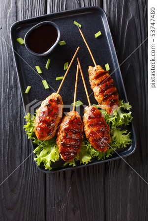 Tsukune Japanese chicken meatballs, skewered and Tsukune Japanese chicken meatballs, skewered and 53747480