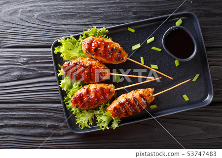 Tsukune Japanese chicken meatballs, skewered and Tsukune Japanese chicken meatballs, skewered and 53747483