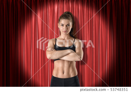 Front crop image of fit confident woman in crop - Stock Photo [53748351]  - PIXTA