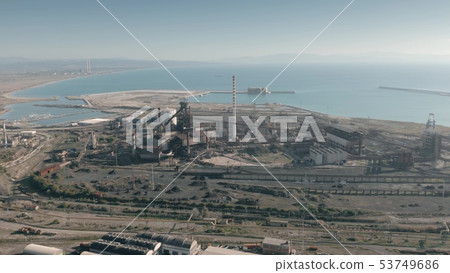Aerial view of old industrial facility in port area. Piombino, Italy Aerial view of old industrial facility in port area. Piombino, Italy 53749686