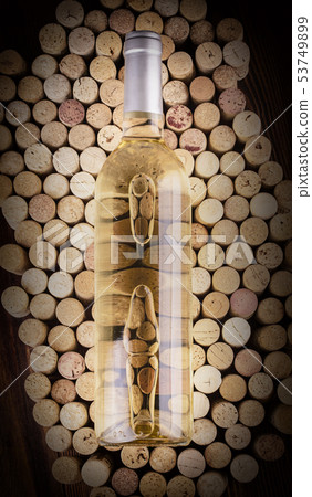 The bottle of light wine on wine corks The bottle of light wine on wine corks 53749899