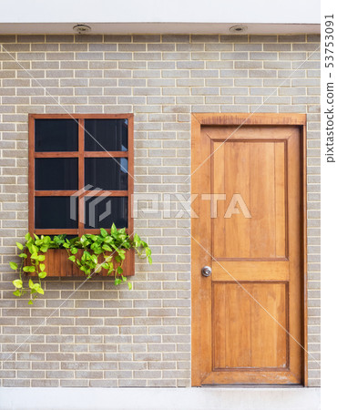 Wooden windows and wooden doors on brick walls. Wooden windows and wooden doors on brick walls. 53753091